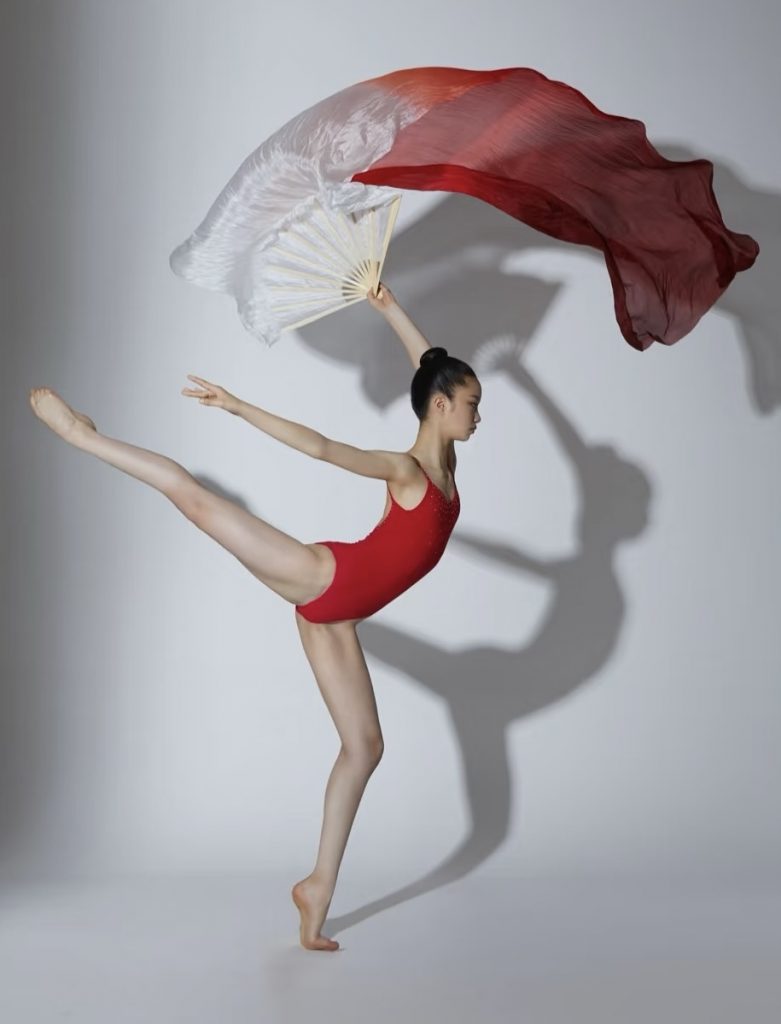 A Chinese performer with a long silk fan